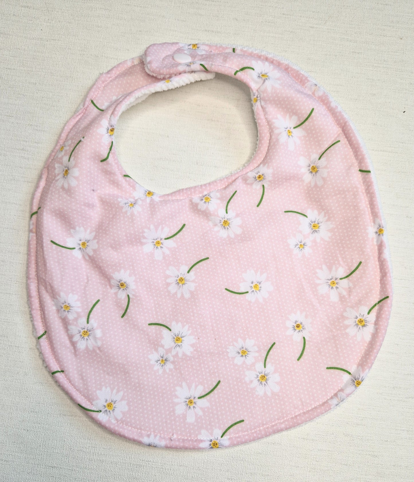 Pink daisy dribble bib