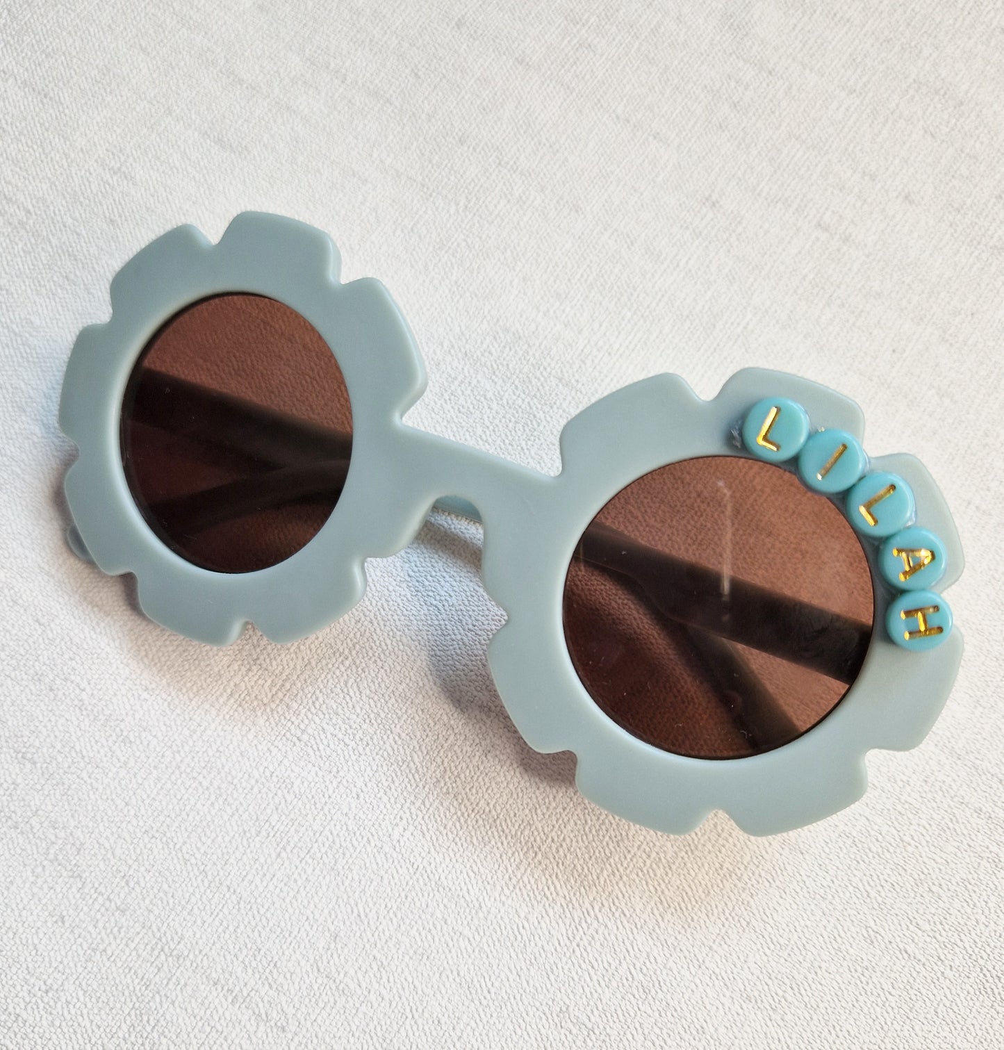 Soft teal childrens flower sunglasses